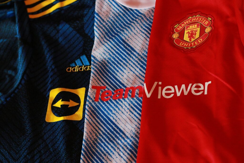 a pair of blue and red striped shirts with white text