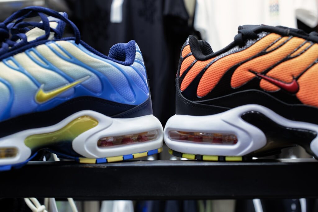 a pair of nike air max plus sneakers